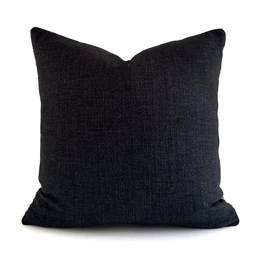 Back of quadrant cushion showing cushy colour raven on a white background