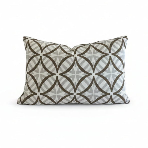 A rectangular lumbar cushion in a geometric outdoor fabric 