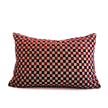 Red and black checkered pillow on a white background
