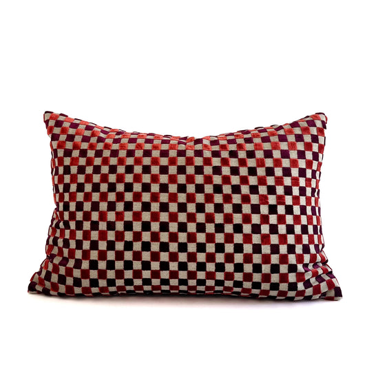 Red and black checkered pillow on a white background