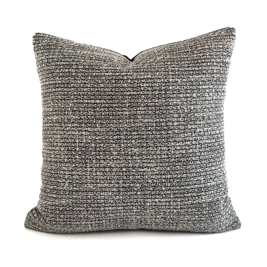Textured quadrant cushion on a white background