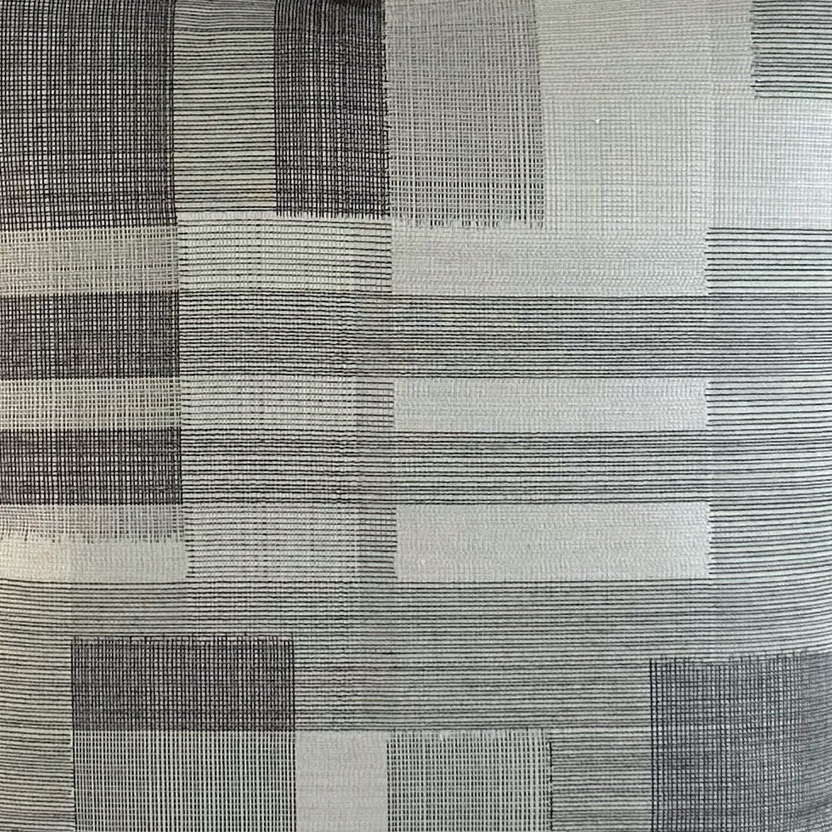 Close up of grey and white checkered style fabric.