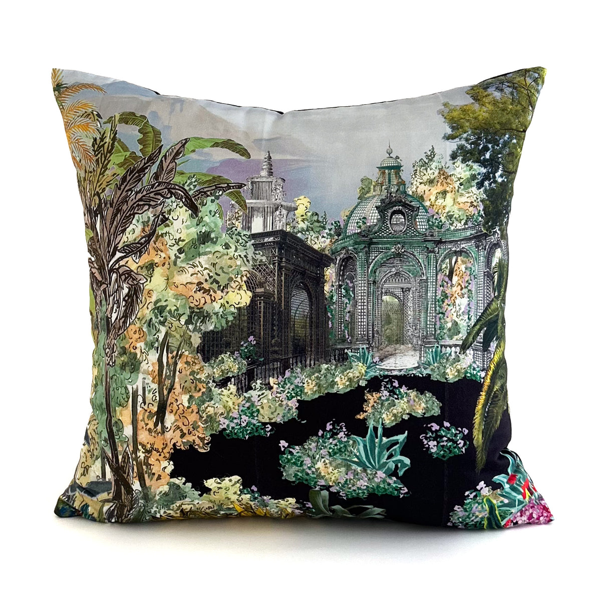 Decorative cushion with a fantasy garden design featuring architecture and nature elements.