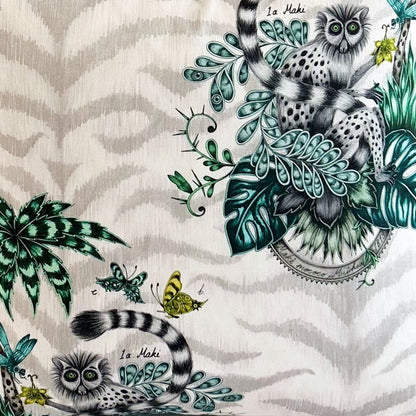 Decorative fabric with animal and nature-themed patterns on a white background