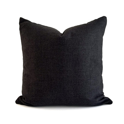 Dark gray pillow on a white background