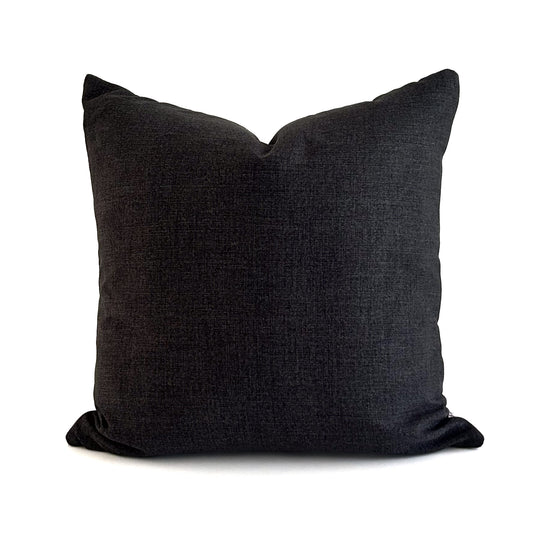 Dark gray pillow on a white background
