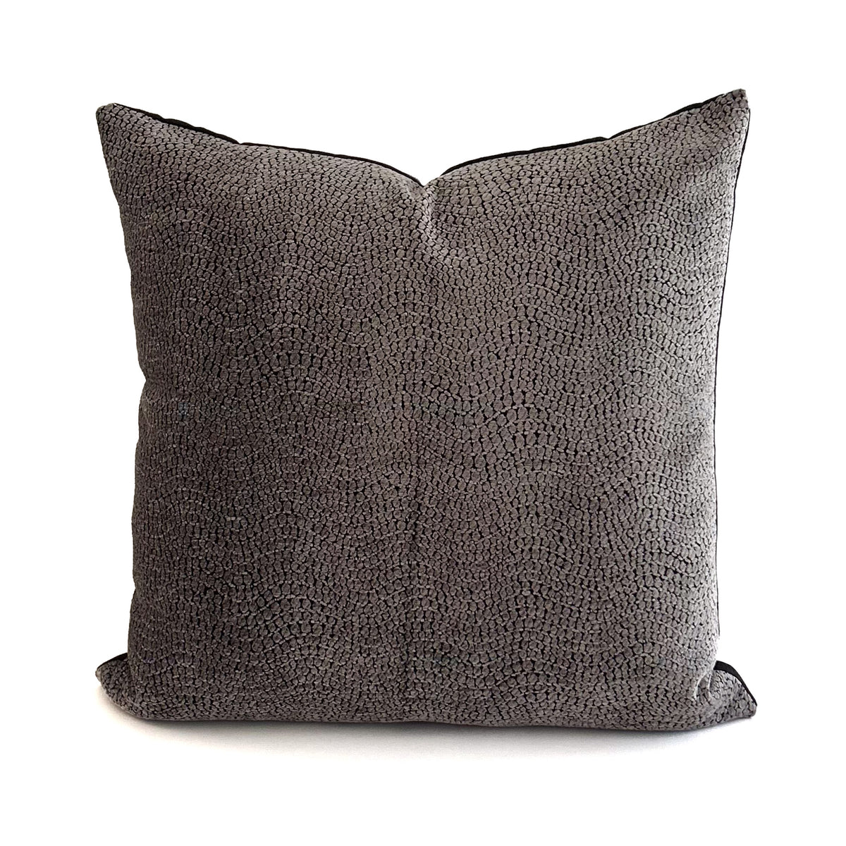 Textured grey cushion on a white background