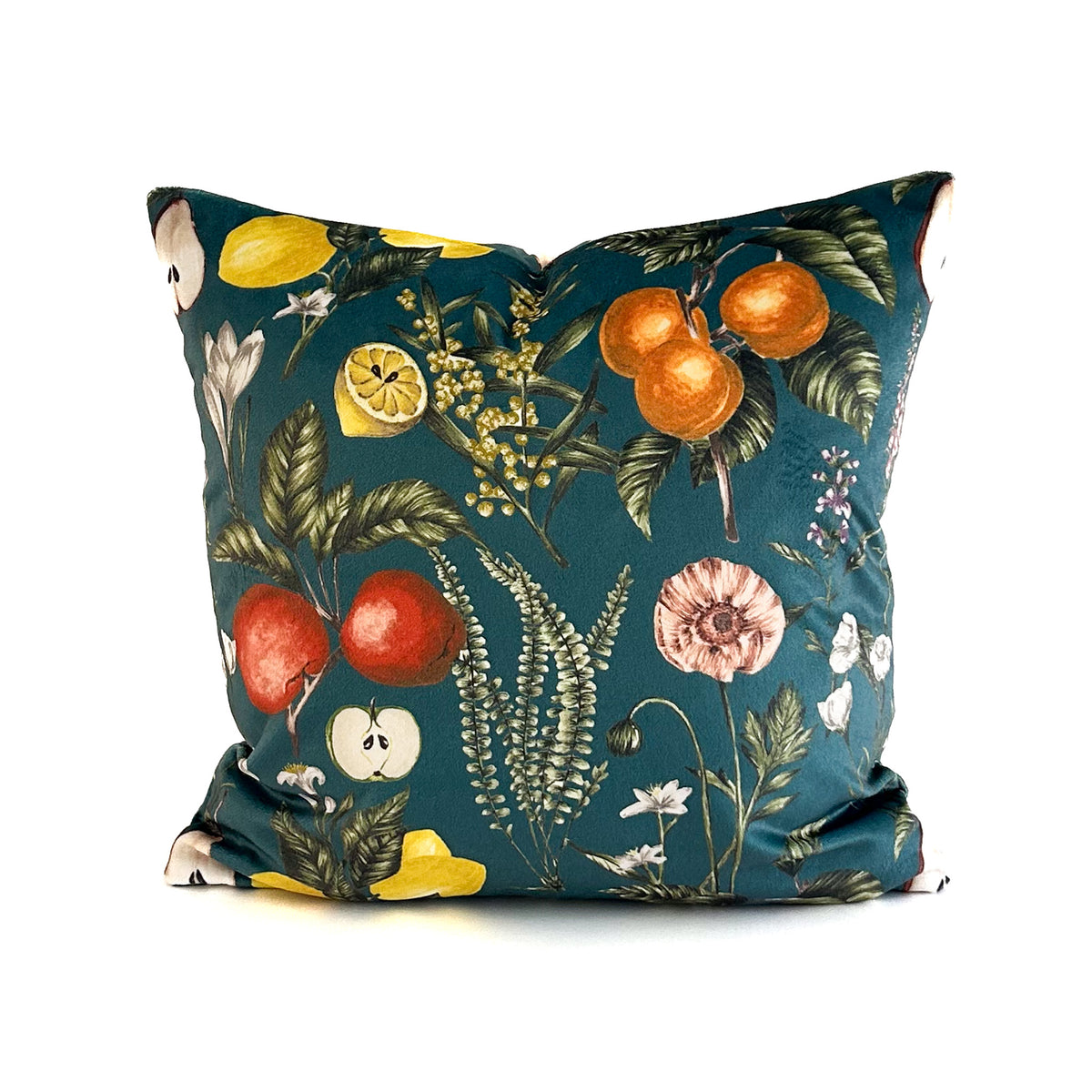 Decorative cushion with a botanical and fruit pattern on a teal background