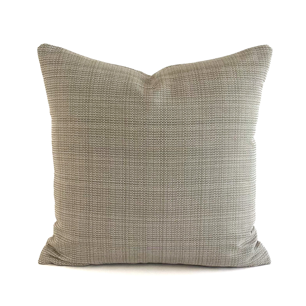 Textured beige cushion on a white background