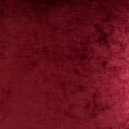 Red velvet pillow on a white background