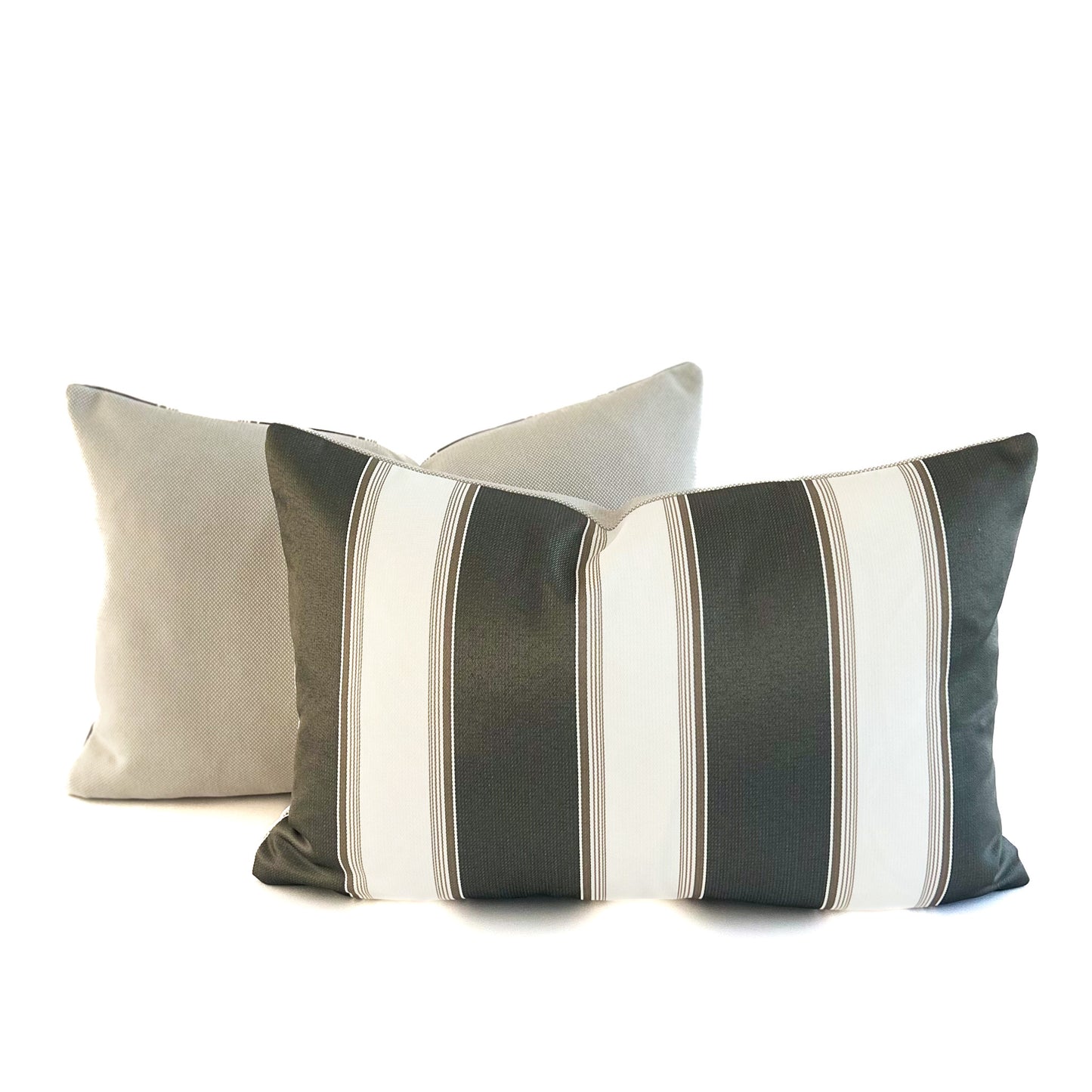 Two decorative cushions with striped patterns on a white background