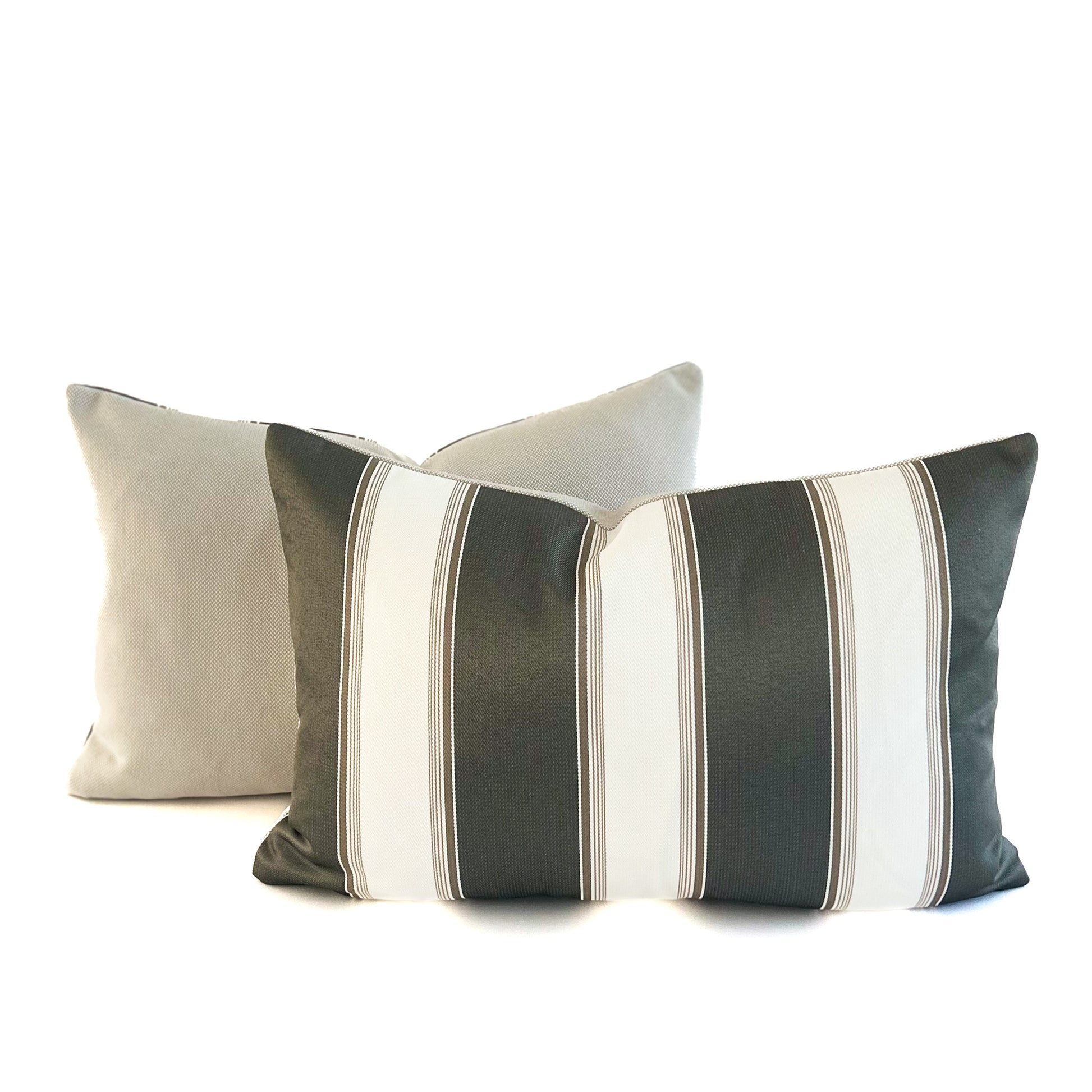 Two decorative cushions with striped patterns on a white background