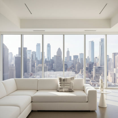 Gray and white checkered cushion in a modern white apartment 